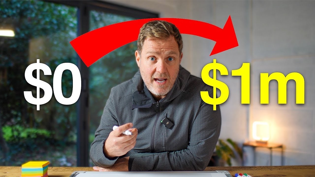 Simon Squibb pointing a marker at camera beside a whiteboard, with a red arrow running from the words zero dollars to one million dollars